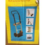 A boxed and unused hand truck or sack barrow.