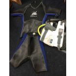 A childs two-piece wet suit; and a kite harness. (2)