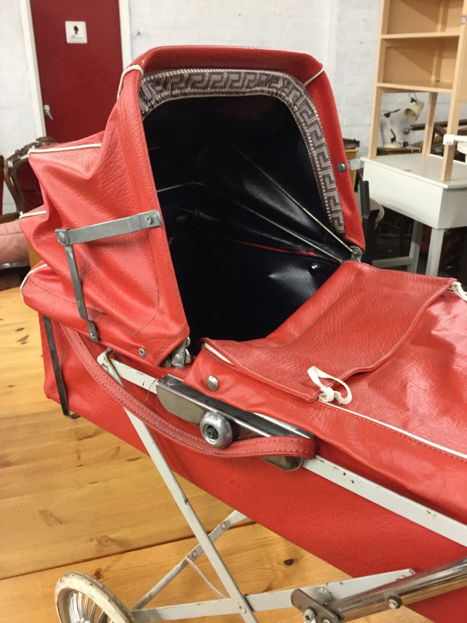 A 70s childs toy pram with vinyl detachable carrycot and cover, having concertina hood. - Image 2 of 3