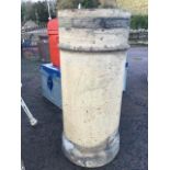 A wide tubular stoneware chimney pot moulded with rings, supported on a plinth. (31in)