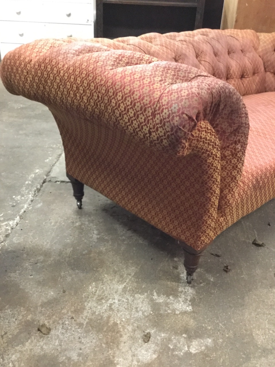 A Victorian chesterfield sofa with button upholstery and sprung seat, raised on turned tapering - Image 2 of 3