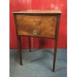 A nineteenth century mahogany bedside table, the rectangular tray top above an up-and-over door with