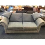 An upholstered sofabed, with fold-out tubular sprung base and loose mattress, the settee with