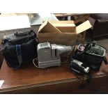 A cased Sony video camera recorder with various accessories including batteries with charger, a