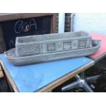 A composition stone plant trough modelled as a canal barge titled Lucy Ann. (32in)