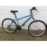 An Apollo lightweight aluminium Aspire bicycle with padded seat, sprung frame, Gripshift Shimano