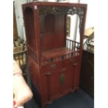 A nineteenth century painted Chinese cabinet, the open top framed by pierced foliate scroll carved