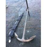 A 3ft cast iron anchor with curved spade blade and ring above T-bar; and a Beaver weighted divers