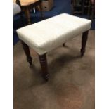 A rectangular Victorian mahogany stool, the upholstered seat on turned tapering legs. (21in)
