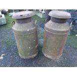 A pair of rusty old milk churns & covers with side handles. (26.5in) (2)