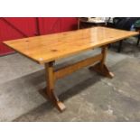An oak refectory table with later rectangular pine top supported on an arts & crafts style dowel