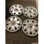 A set of four Ford 17.25in wheel hub caps. (4)