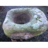 An ancient sandstone quern. (17.5in x 13in)