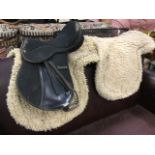 A wintek pony saddle; and two numnah saddle pads. (3)