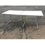 A rectangular aluminium framed folding table with tubular legs. (24in x 64in x 26in)