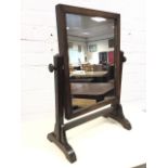 An oak dressing table mirror, the plate in plain frame on square supports with shaped feet. (18in