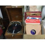 An oak cased Academy 'super portable' wind-up gramophone, the working machine with crank handle,