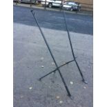 A pair of 5ft wall mounting flagpoles, the poles with button finials and angled brackets. (2)