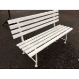 A painted garden bench with slatted back and seat on tubular metal frame. (55in)