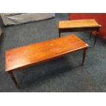 A rectangular reproduction mahogany coffee table with crossbanded top on fluted turned tapering