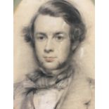 A Victorian oval portrait of a young man, charcoal and chalk, possibly monogrammed MV, mounted &