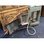 Two radiant gas heaters on stands; and an Alladin paraffin heater. (3)