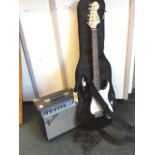 A cased Squier Srat guitar by Fender, complete with Fender Frontman 15G practice amp, leads,