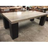 A contemporary marble dining table, the rectangular polished travertine slab on square ribbed corner