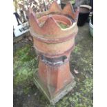 A 3ft tubular stoneware chimney pot, having crown above moulded bands, the chamfered octagonal