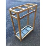 A Whytock & Reid rectangular oak stickstand with three divisions above a galvanised drip tray. (20in