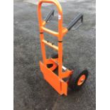 A brand new sackbarrow with extending handles above a sprung load platform, supported on solid