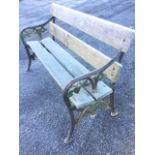 A Victorian cast iron bench, having twin plank seat & back, the ends cast with pierced vine leaf