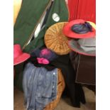 A barrel shaped cane laundry basket & cover; and miscellaneous ladies dress hats, a coat, a dress, a