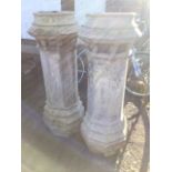 A pair of large stoneware octagonal chimney pots, the moulded crowns with apertures above columns