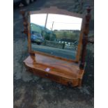 A nineteenth century mahogany dressing table mirror with arched plate in boxwood strung frame on