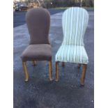 A pair of walnut chairs with spade shaped padded backs above stuffover upholstered seats,