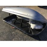 A locking Thule car roof box, complete with brackets, rails, manual, instructions, key, etc. (70in x