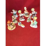 A Hummel figure of a girl squatting with basket of chicks on circular base; and eight similar German