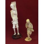 A Japanese carved ivory figure of an old gentleman with fish on rope, mounted on stand; and