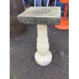 A composition stone column with square concrete platform top. (29in)
