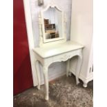 A painted French style dressing table, the mirror in moulded frame supported on turned columns