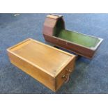 A Victorian oak dolls cradle on rockers with shaped canopy; and a locking rectangular dovetailed box