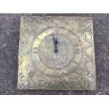 A square brass faced wallclock, the embossed dial with entwined decoration having roman chapter