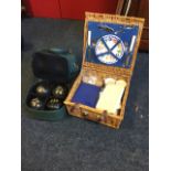 A 70s cased two-piece picnic set; and a cased set of Thomas Taylor bowls, the bag with tapes,