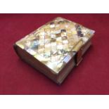 A Victorian leather bound photograph album with mother of pearl cover and brass mounts, containing