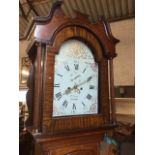 A nineteenth century oak longcase clock, the movement with enamelled and gilded dial by W Scott of