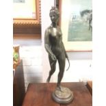 Houdon, French nineteenth century bronze depicting Diana the huntress with bow & arrow, cast on leaf