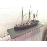 A late Victorian composition model boat, the three masted steamer modelled with rigging, sails,