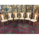 A set of six pine kitchen chairs, with upholstered seats & back panels, raised on turned legs. (6)