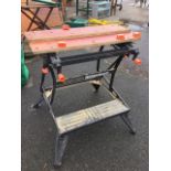 A Black & Decker workmate 800, with vice table top on folding supports with angled legs.